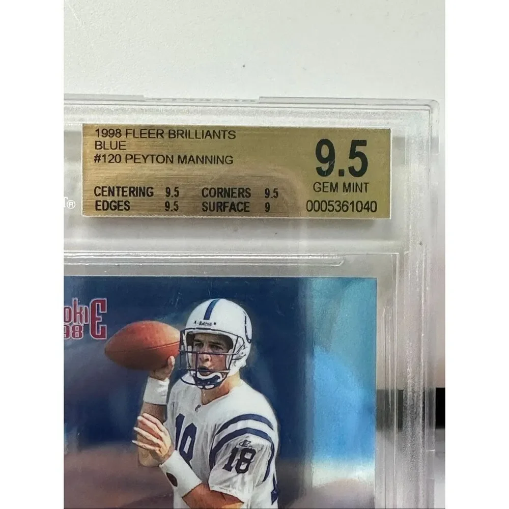 1998 Peyton Manning Fleer Brilliant Blue Rookie card. Beckett 9.5